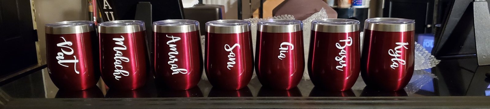 Set of red personalized cups with individual names